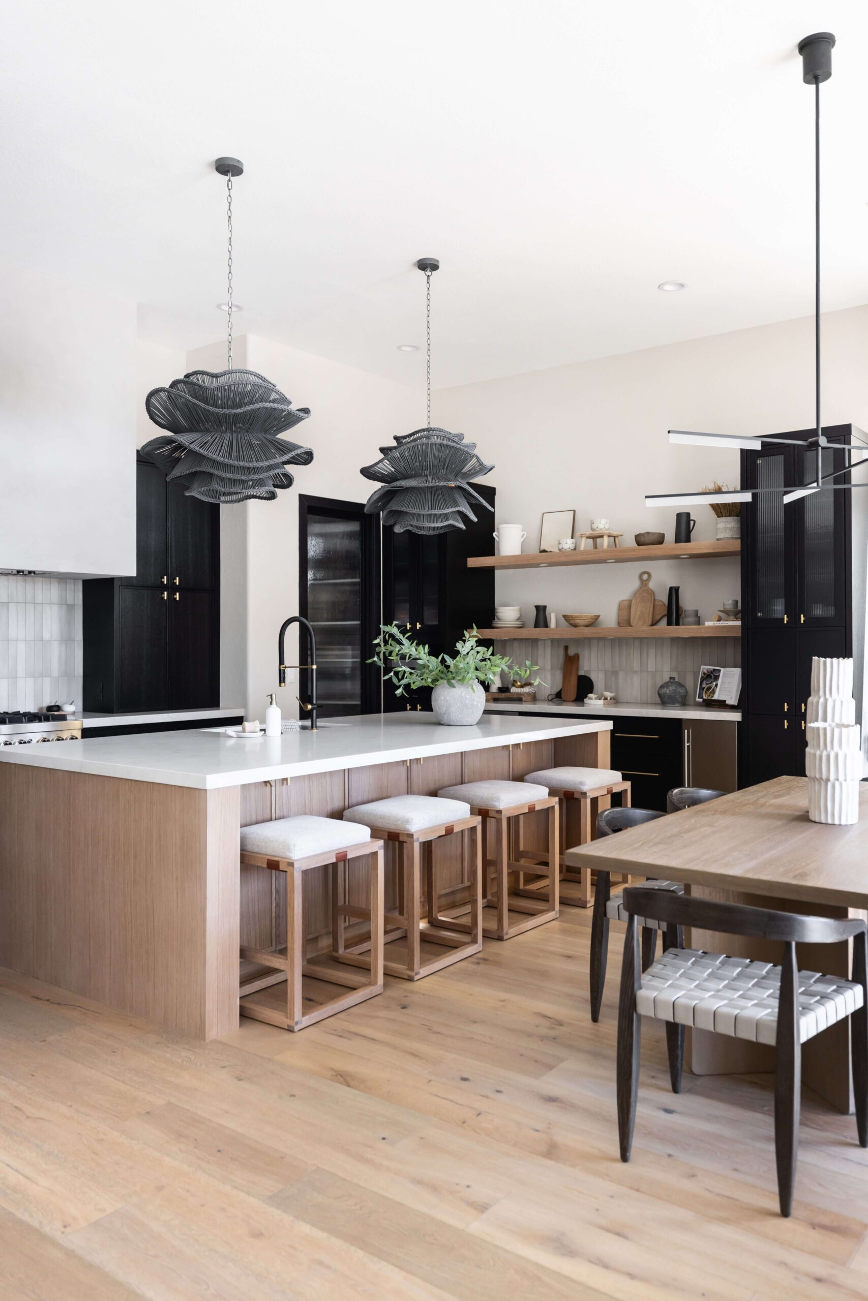 Luxury kitchen with black cabinets and large island, a Living with Lolo project